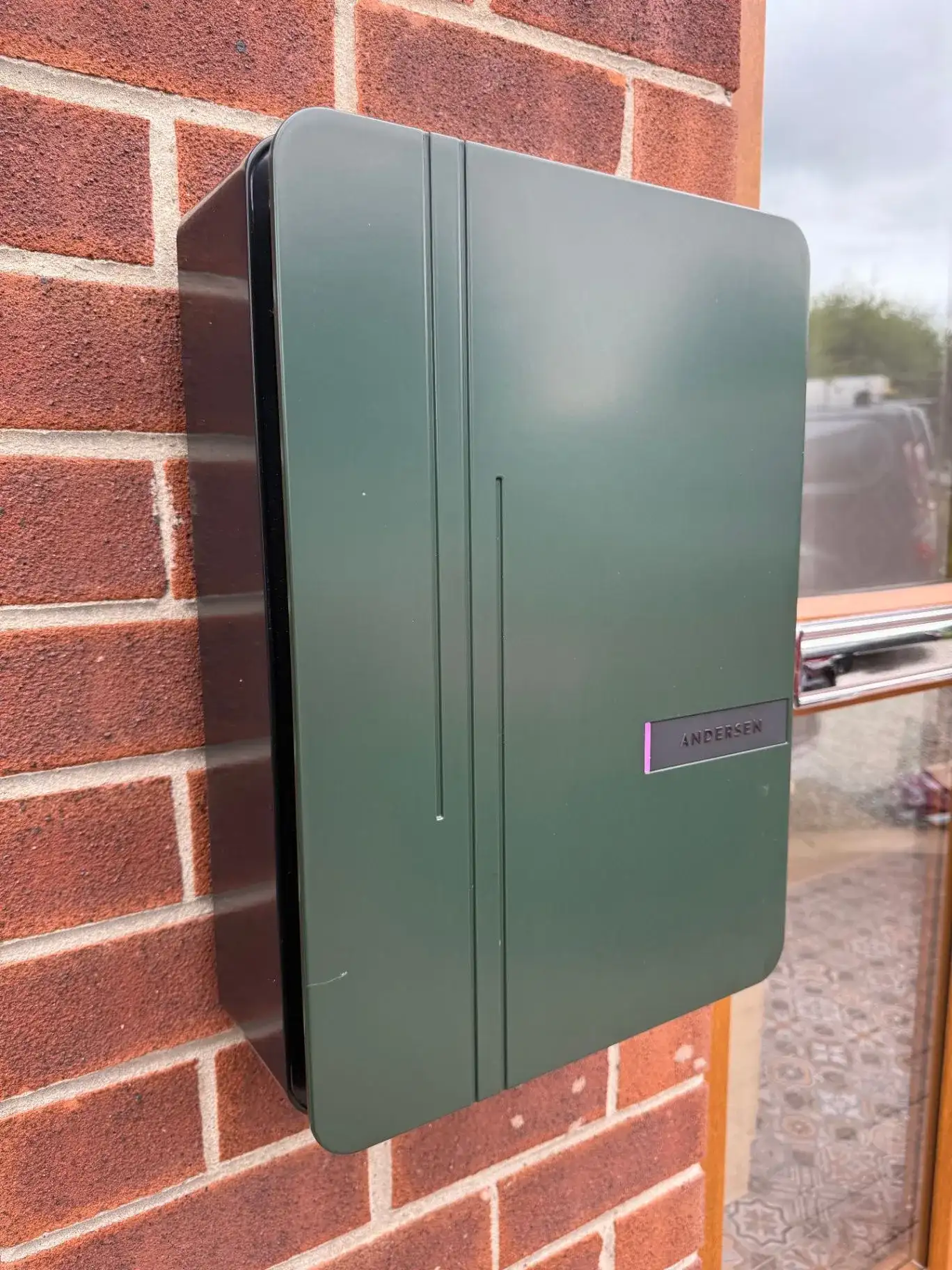 Andersen EV charger installed on a residential exterior wall