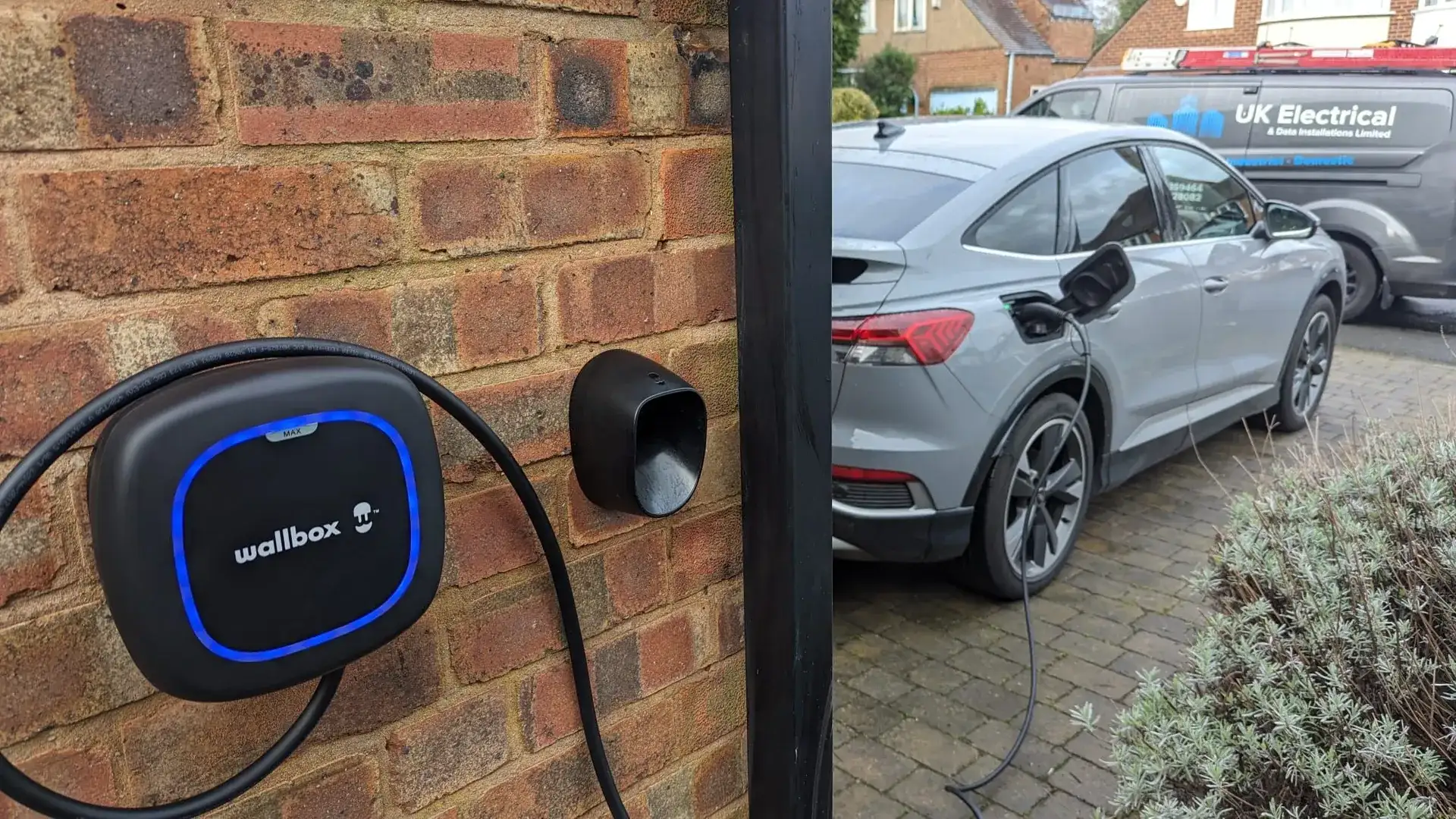 Wallbox EV charger installed on a home exterior wall with tidy cable management