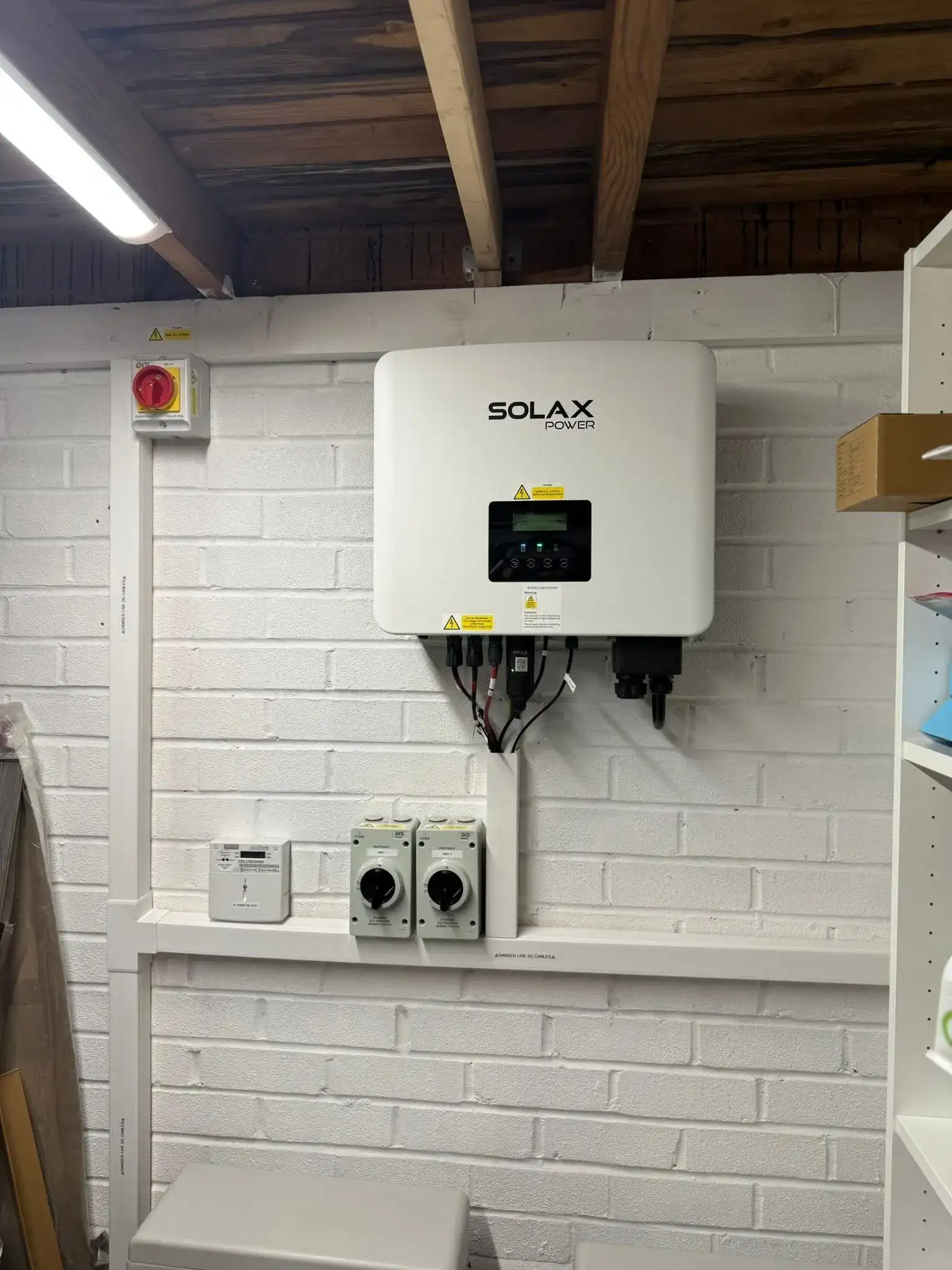SolaX inverter installation with neatly routed electrical cabling